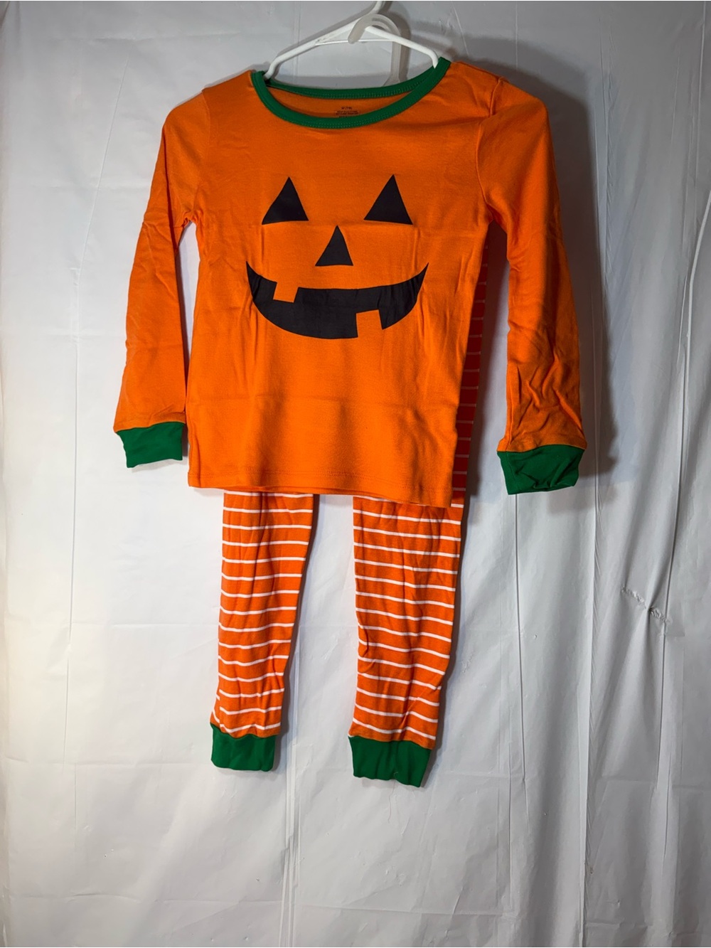 orange and white striped Halloween pajama set size 7/8